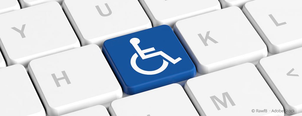 Tastatur mit einer blauen Taste mit Rollstuhlsymbol